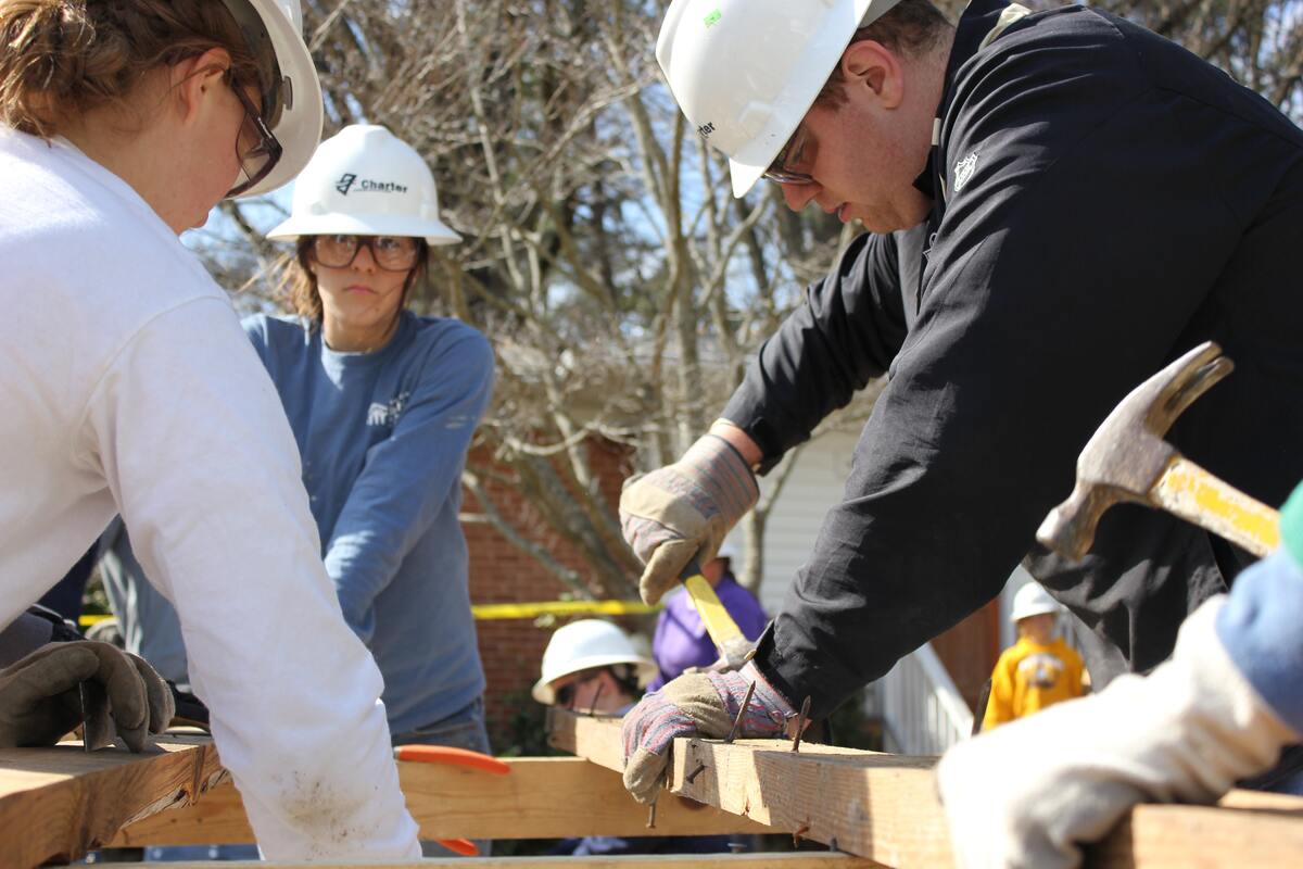 Construction crew building a house