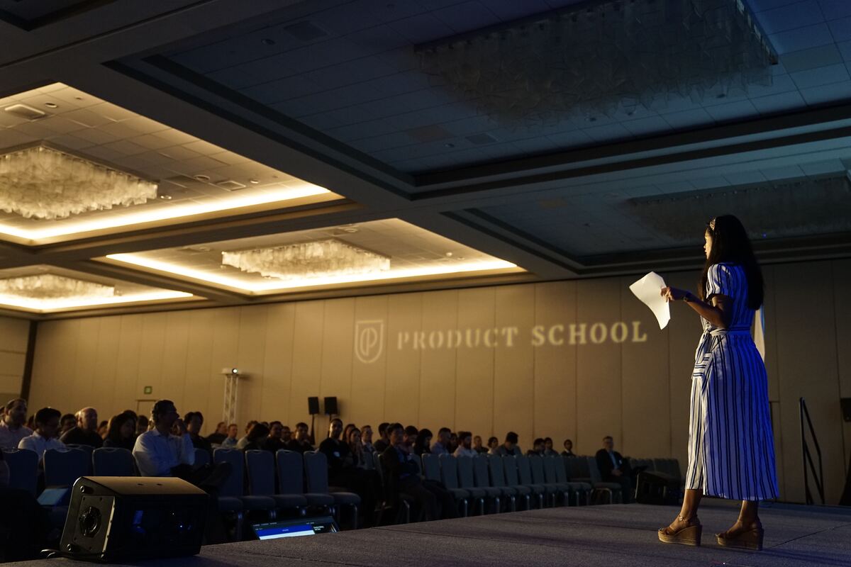 Women in the front of the room presenting