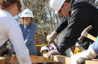 Construction crew building a house